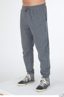 Simeon dressed grey joggers grey sneakers leg lower body sports…